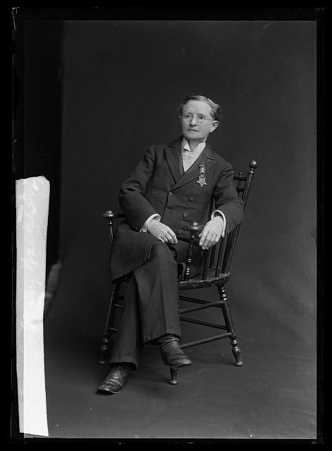 Dr. Mary Walker sitting for a photograph wearing her Medal of Honor